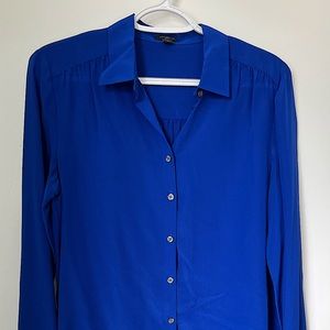 Blue silk button up shirt with collar by Ann Taylor. Size 4.